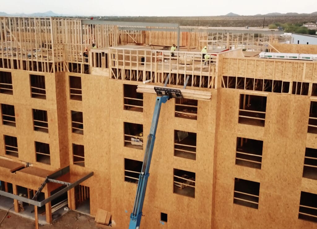 Contractors constructing wooden building