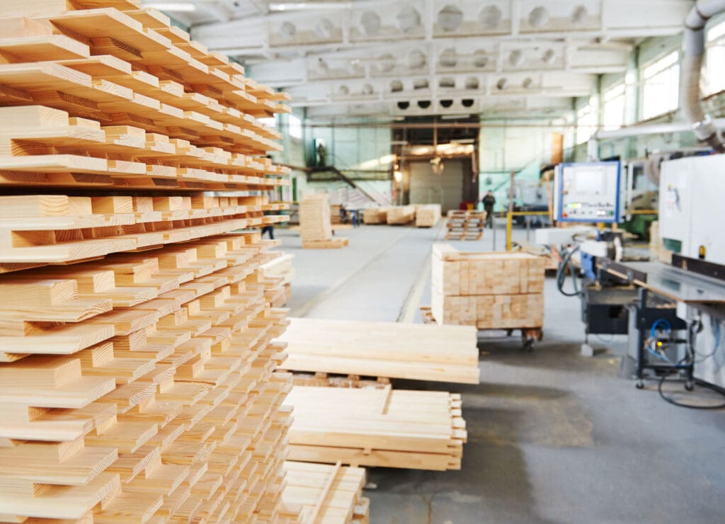 Manufacturing facility with stacked lumber