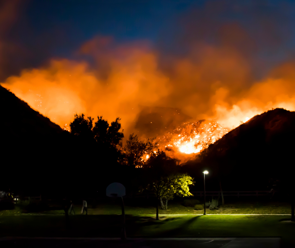 Wildfire behind mountain range